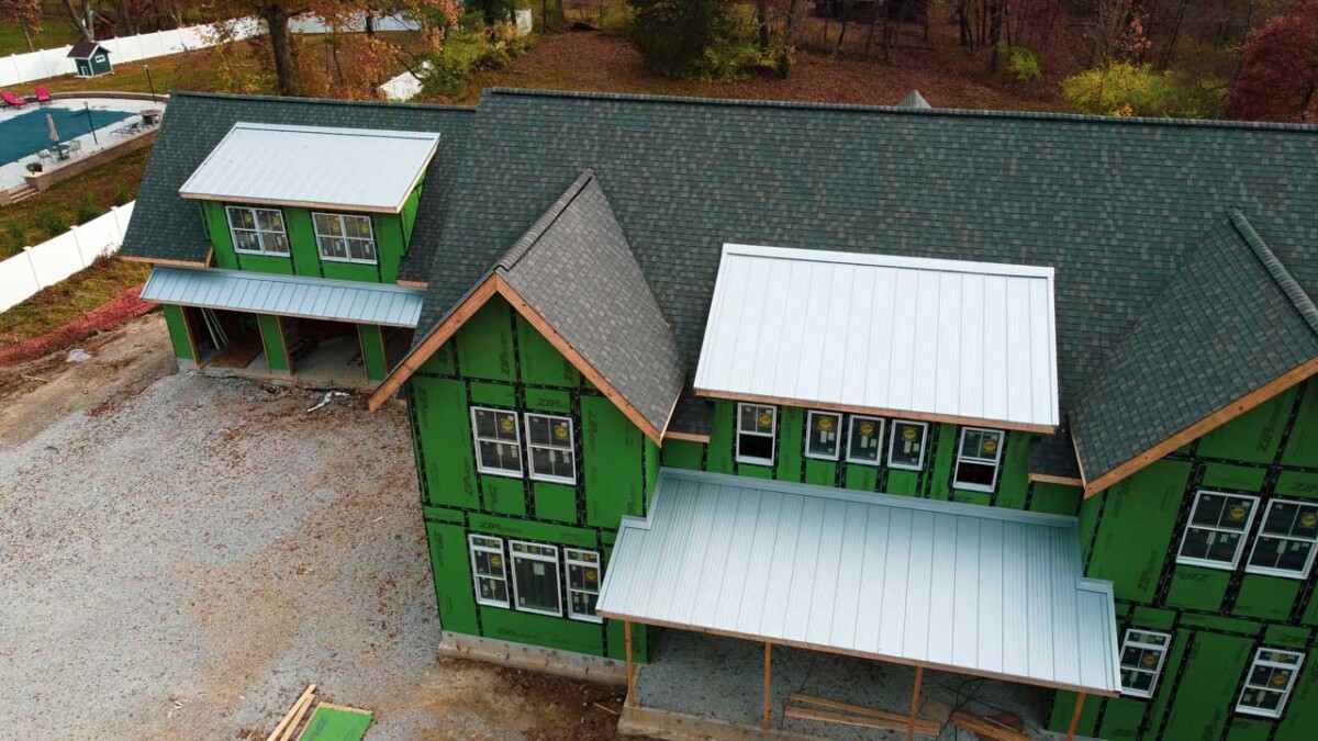 Residential Roof combining Asphalt Shingles with Metal Roofing